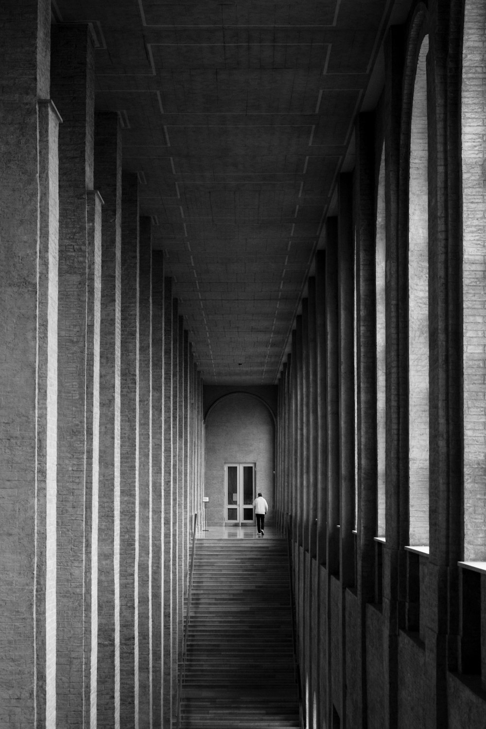 a person walking down a long hallway