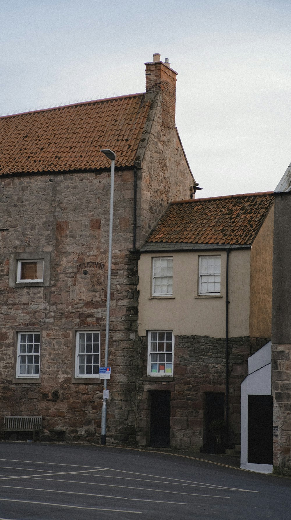 a brick building with a street light