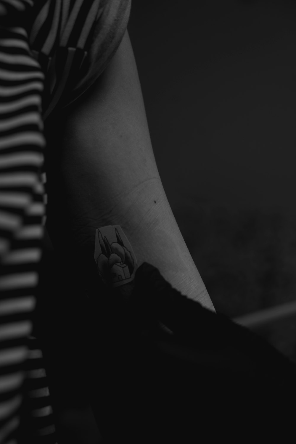a person's arm with a tattoo on it