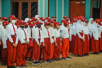 a group of people in red uniforms