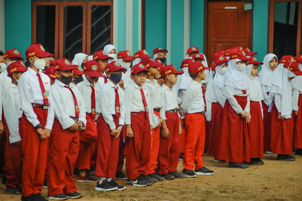 a group of people in red uniforms