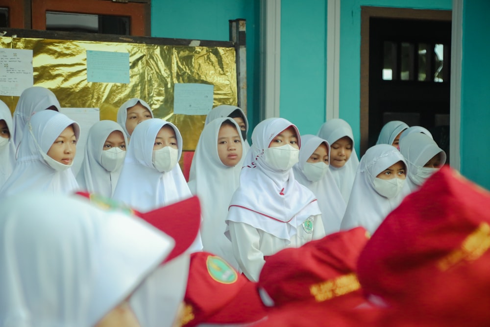 a group of women in white