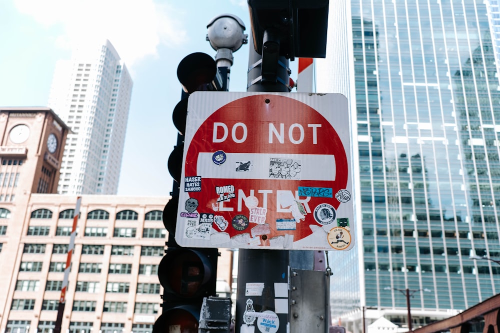 a stop sign with stickers on it