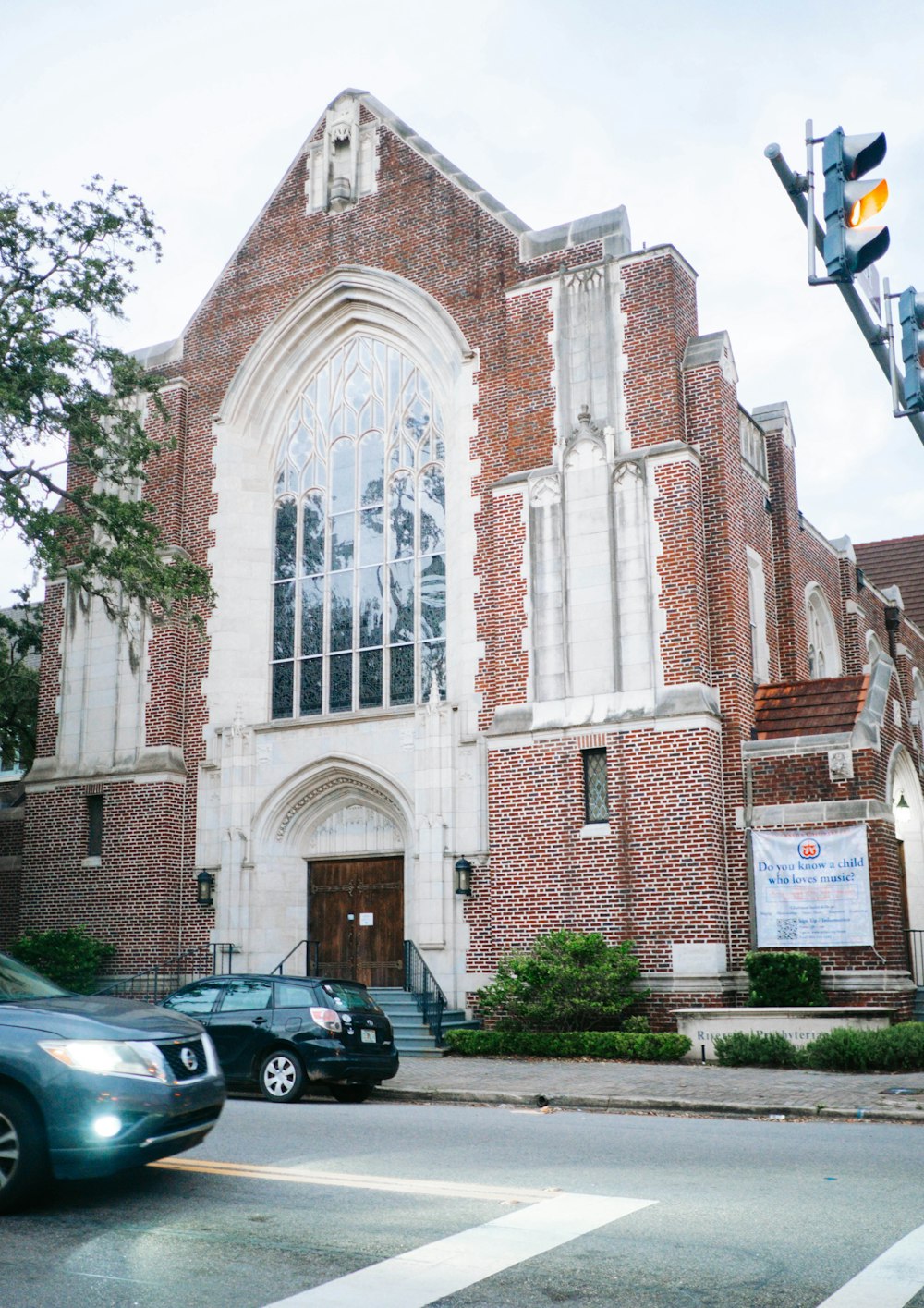 a brick building with a large arched window