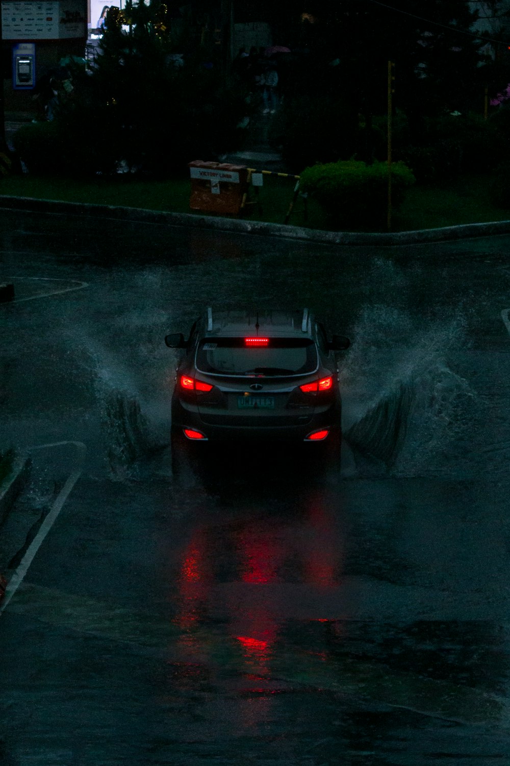 a car driving through a puddle