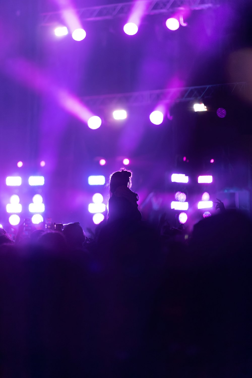 a person on a stage with lights