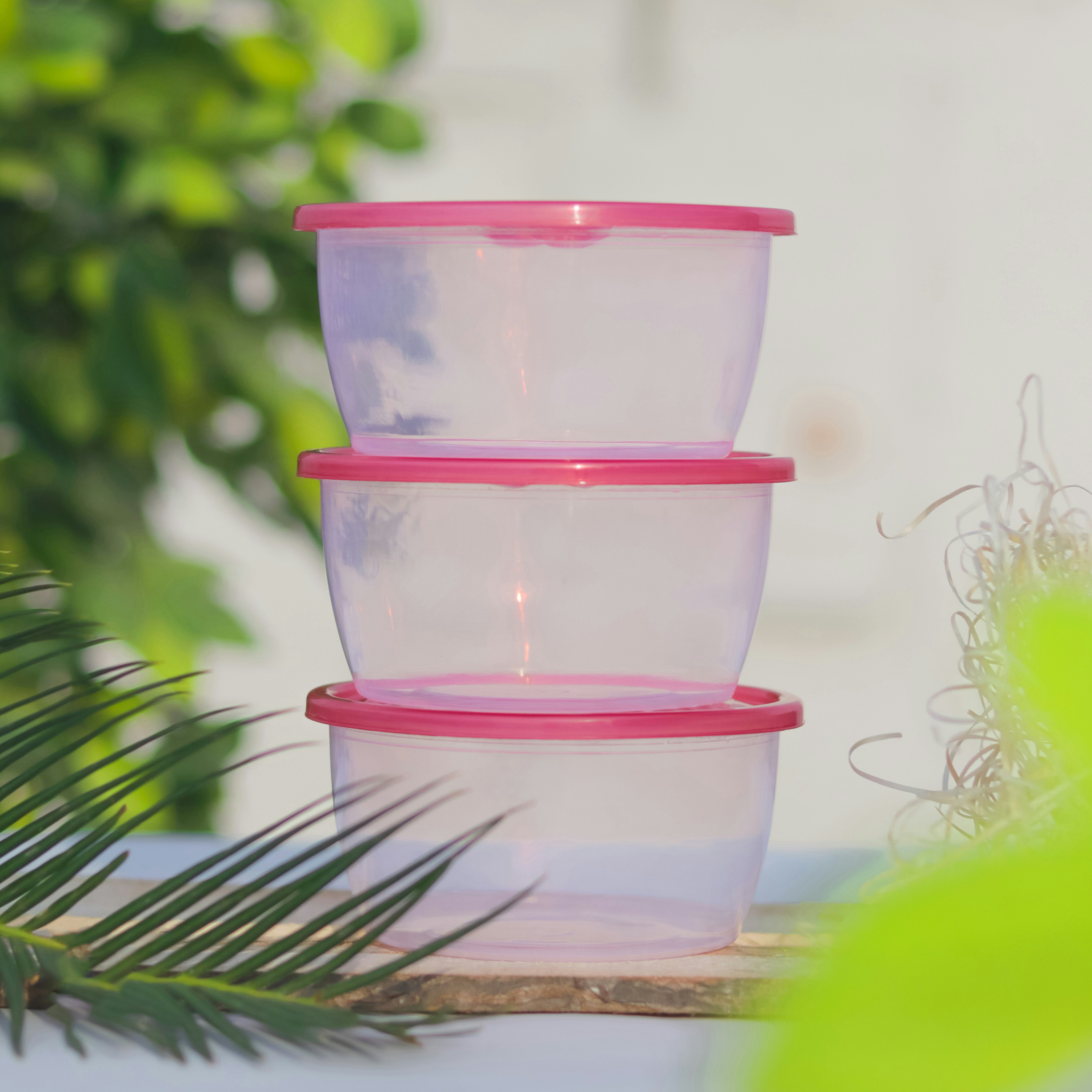 a glass jar with a pink lid