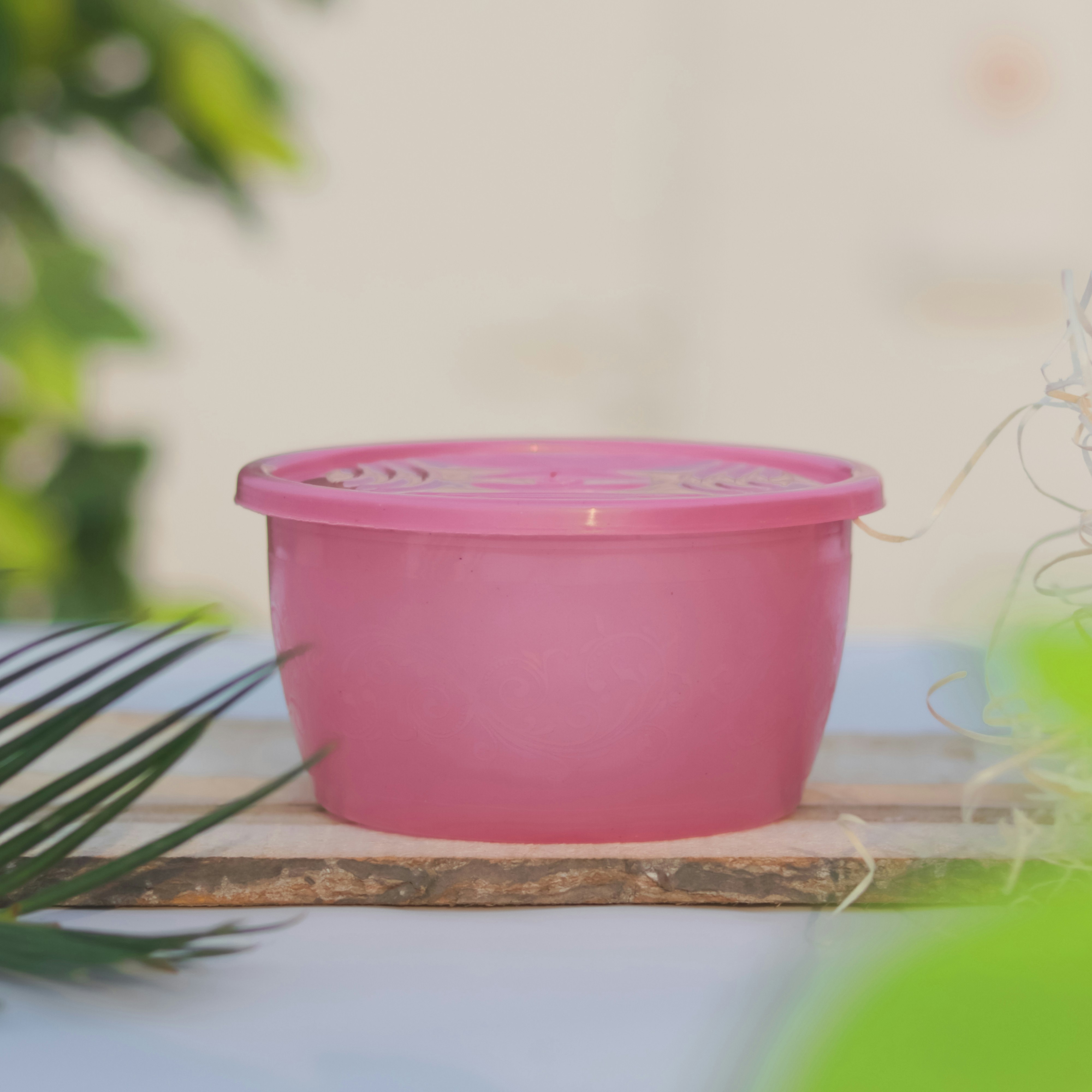 a pink bowl on a table