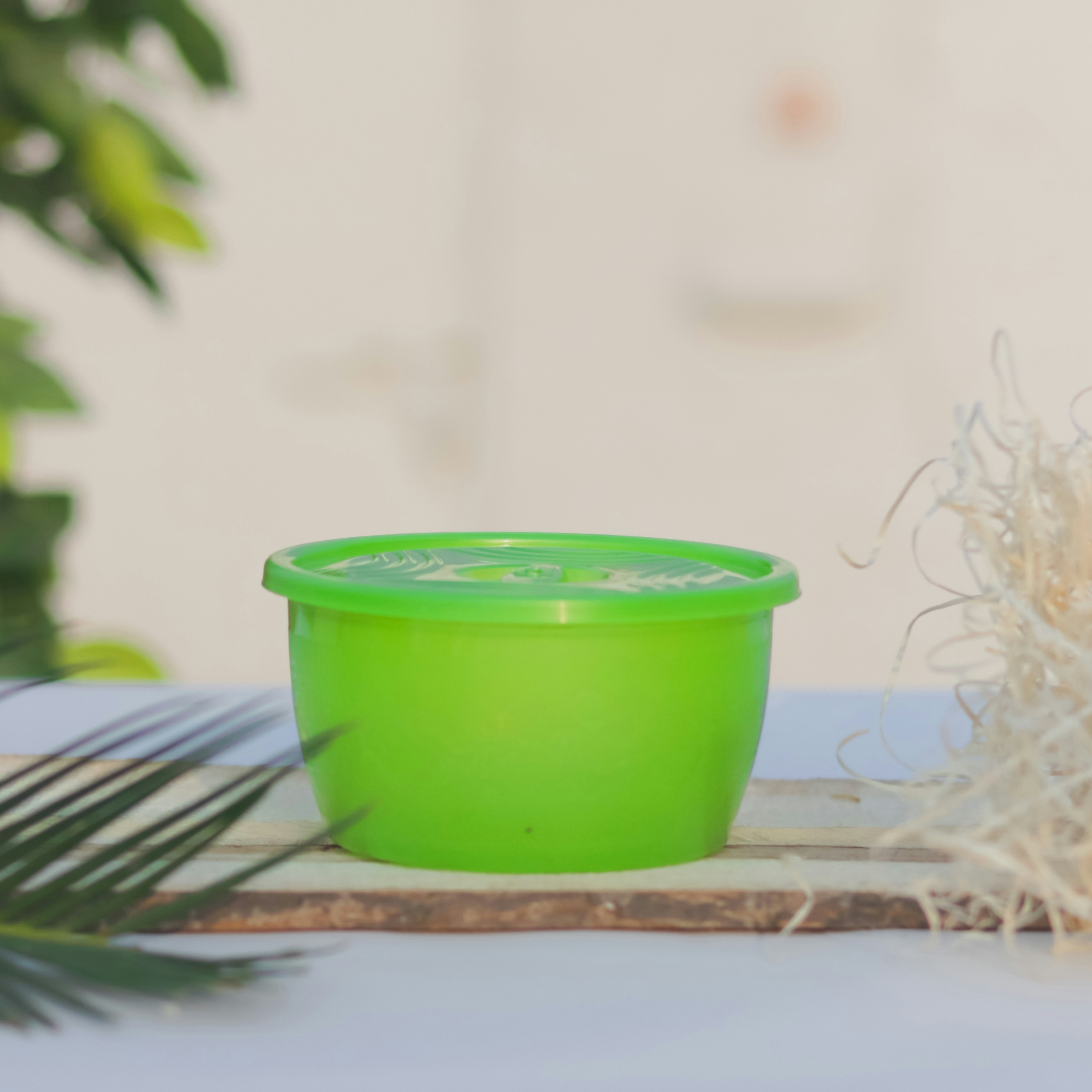 a green bowl on a table