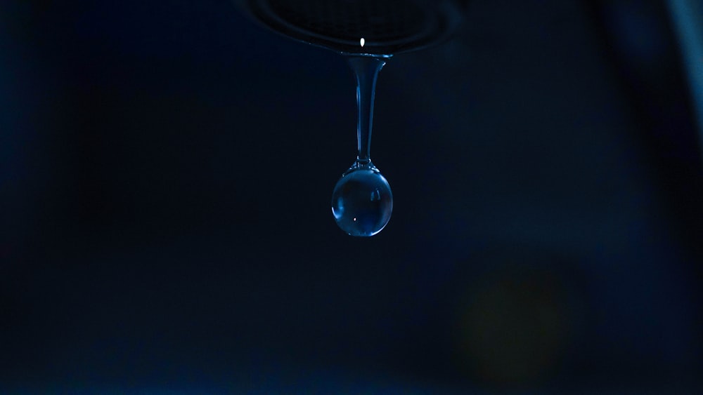 a drop of water falling into a glass