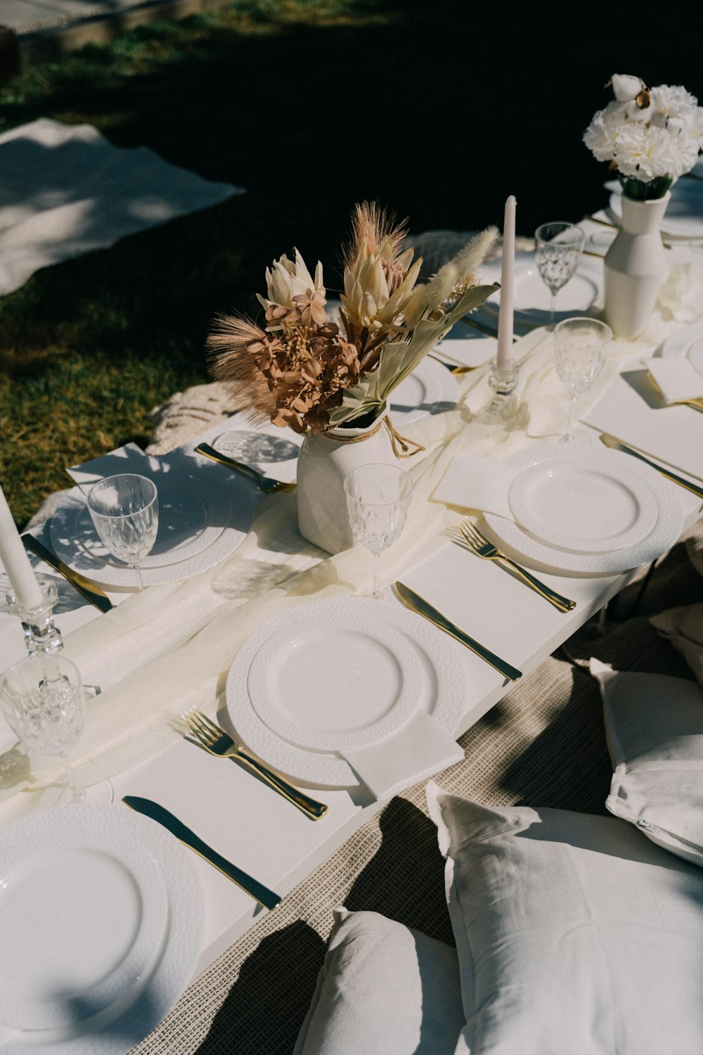 a table set with plates and glasses