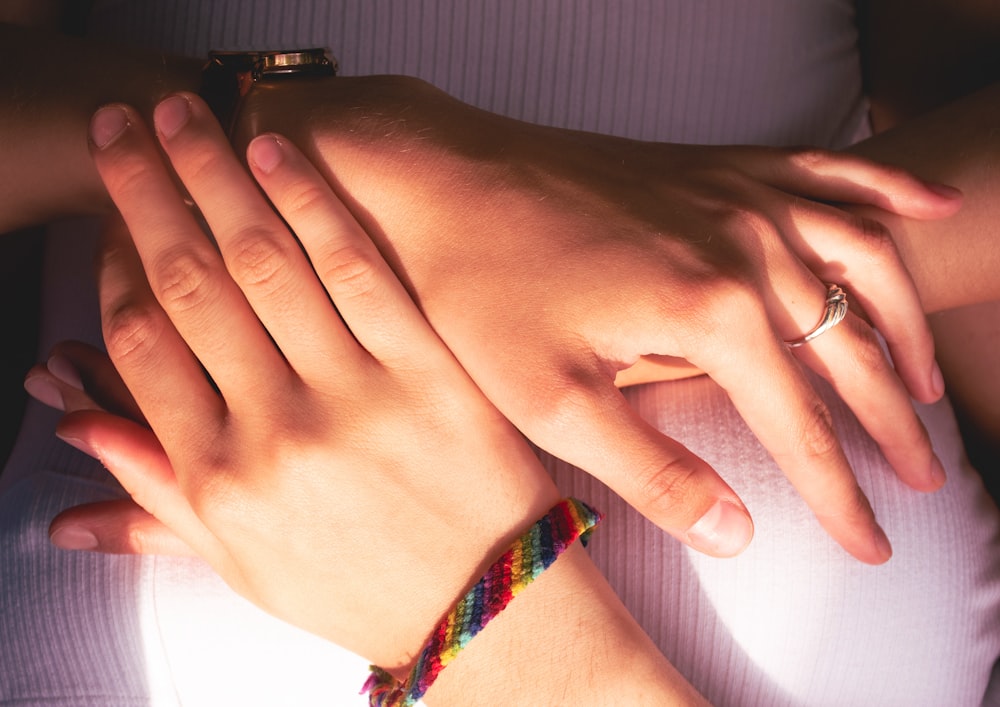 a close-up of hands clasped