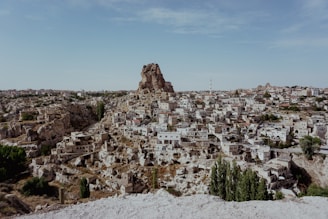 a city with a large rock formation