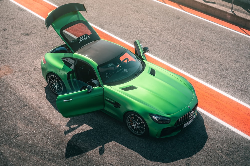 a green car on a road