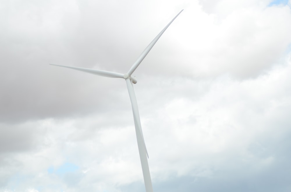 a wind turbine under a cloudy sky