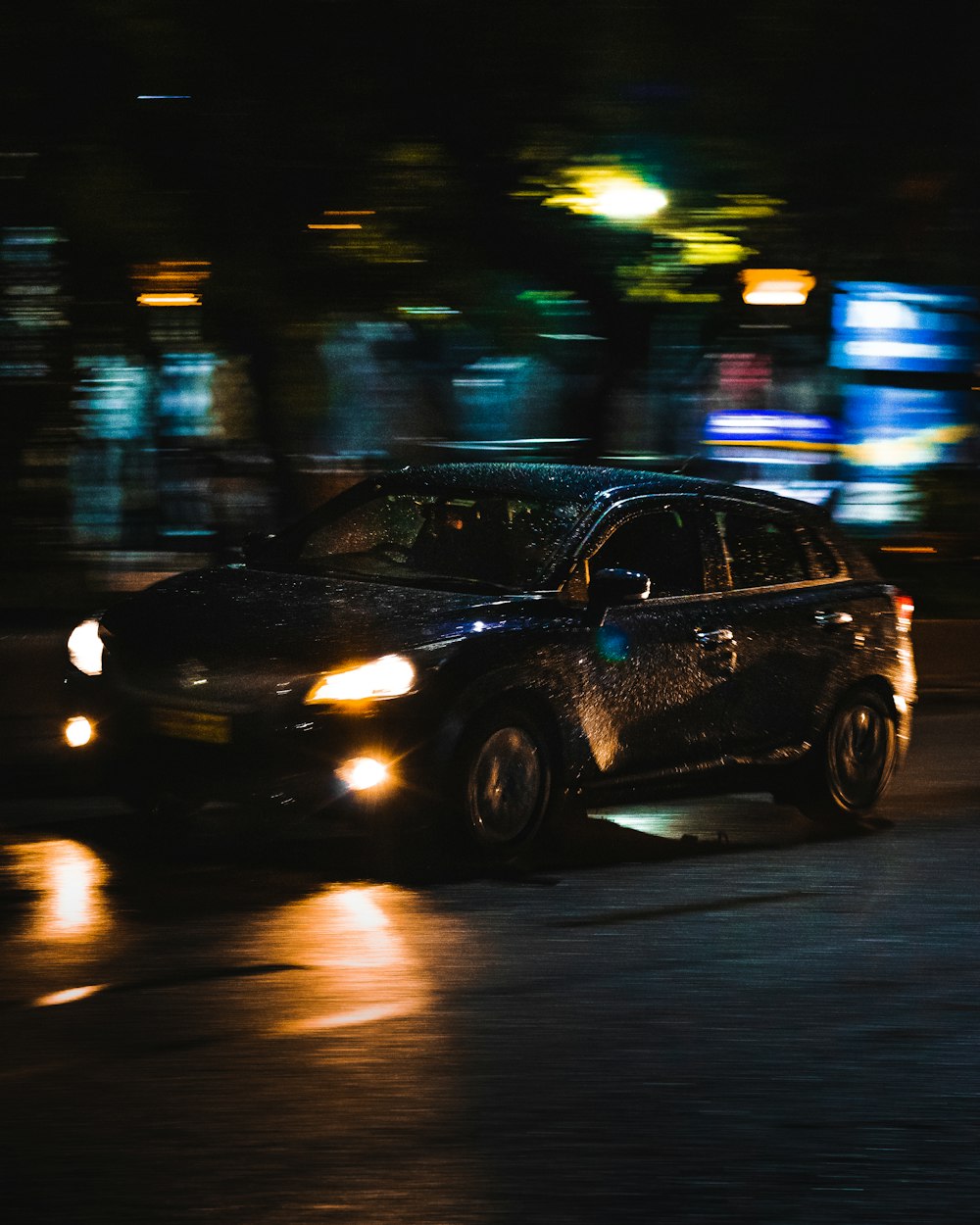 a car parked on a street at night