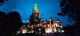 The Simple Temple glowing softly under a twilight sky, with intricate alien symbols etched into its stone walls.