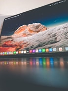 A high-resolution monitor showing a vivid landscape wallpaper.