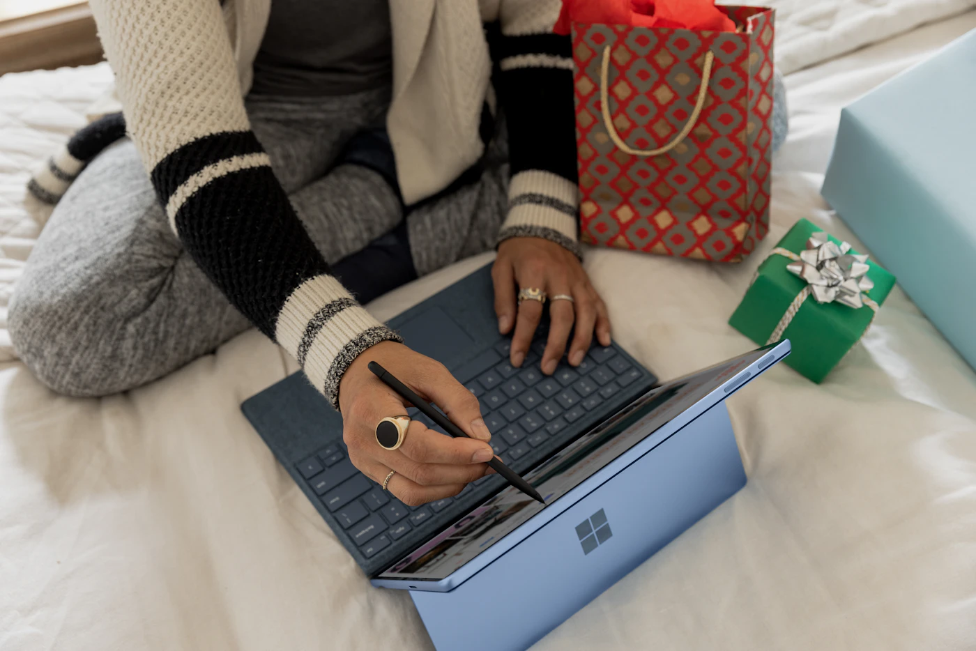 Person using a laptop to compare eCommerce platforms and plan an online store build