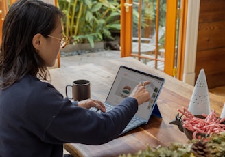 a woman using a laptop