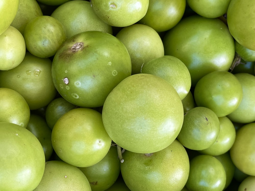 a pile of green fruit