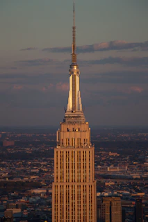 Exterior shot of a towering New York architectural landmark at dusk, symbolizing institutional strength.