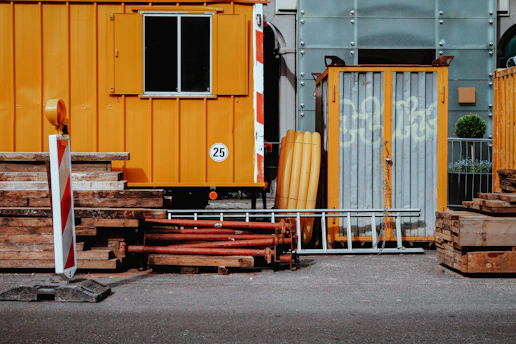 a yellow truck with a few boards