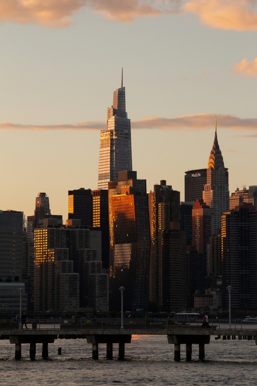 a city skyline with a bridge