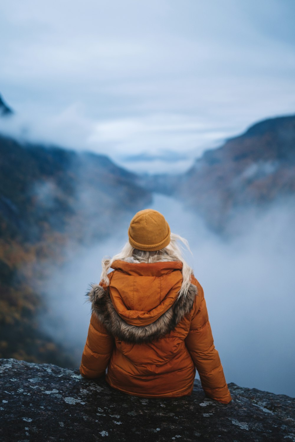 a person sitting on a mountain