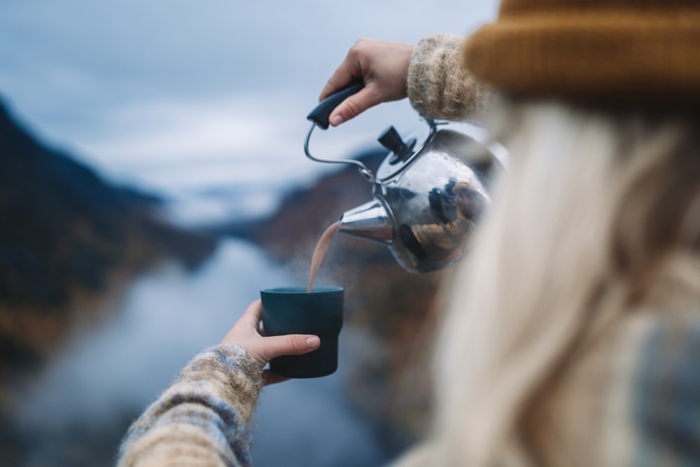 a person holding a magnifying glass to a person's eye