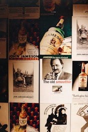 A collage of vintage advertisements featuring John Jameson whiskey, showcasing various styles of advertising with illustrations and photographs. The artwork highlights bottles and glasses of whiskey, along with men enjoying the drink.