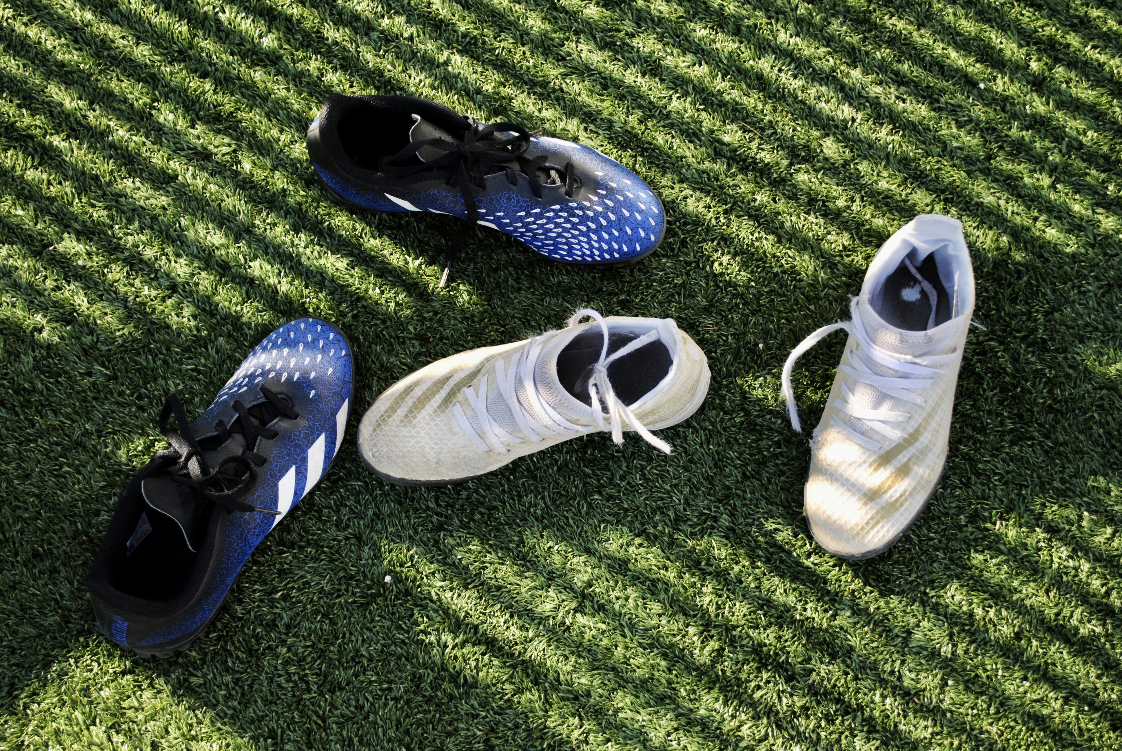 a group of shoes on grass