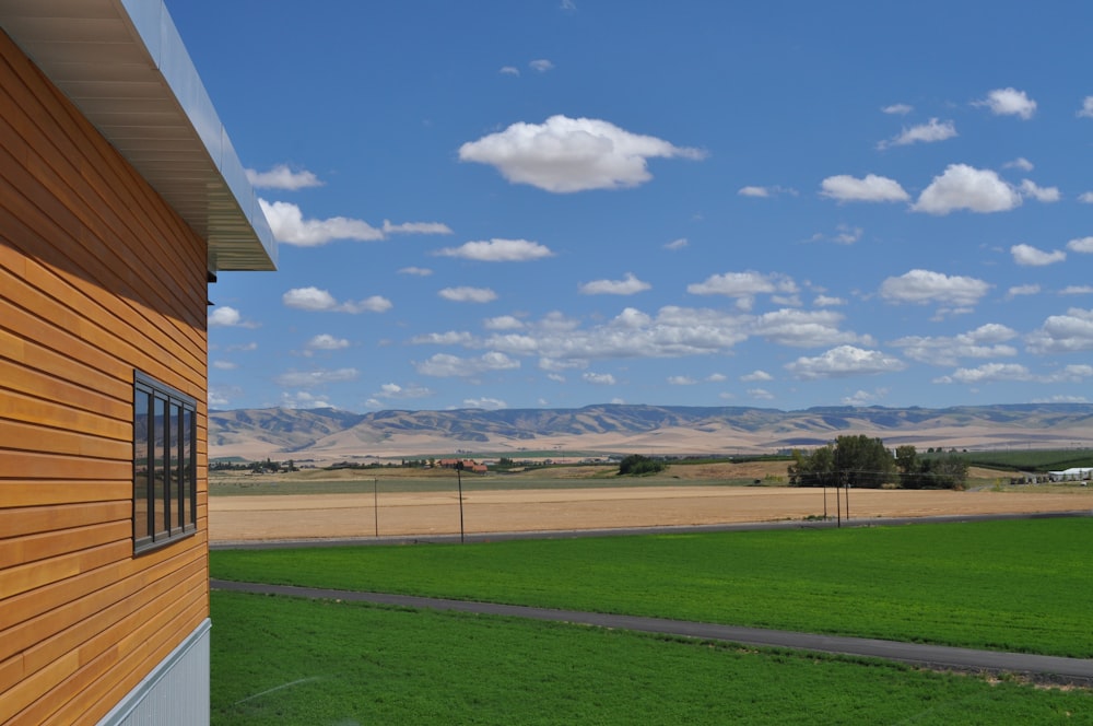 a building with a field in the background