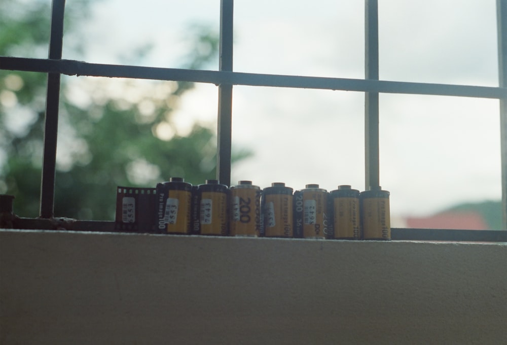 a row of cans on a ledge