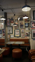 A cozy retro cafe corner with vintage Turkish posters and classic 80s decor.