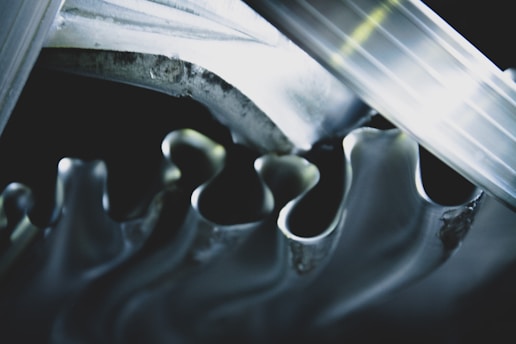 Close-up of shiny car gears meshing smoothly in motion.