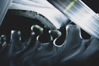 Close-up of sturdy mechanical gears interlocking in a workshop setting