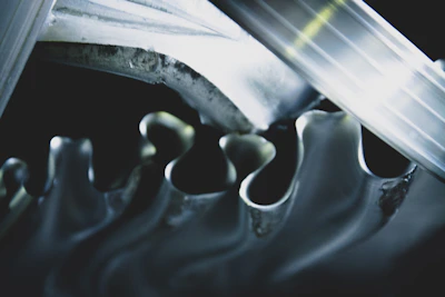 Close-up of sturdy mechanical gears interlocking in a workshop setting