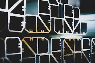 Modern aluminum window system being assembled in a high-tech factory.