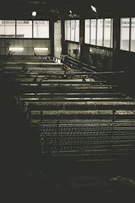 Sleek industrial facility with modern biochar production equipment under dark ambient lighting.