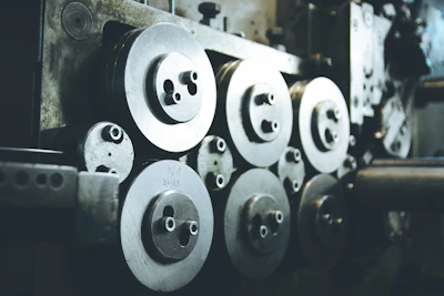 Selection of precision ball bearings displayed on a metallic surface with soft industrial lighting.