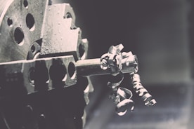 Close-up of a precision lathe machine working on a metal piece
