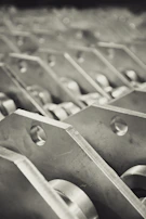 Detailed view of stamped metal sheets stacked and ready for the next manufacturing step.