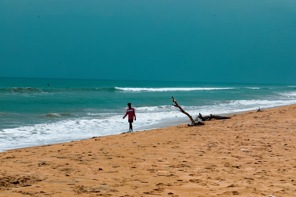 a person walking on a beach