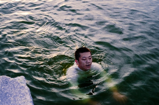a man swimming in water