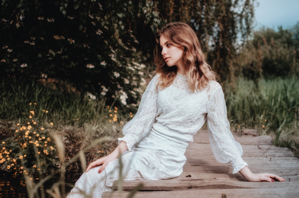 a person sitting on a wooden bench