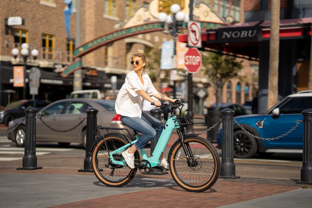 a person riding a bicycle on a city street