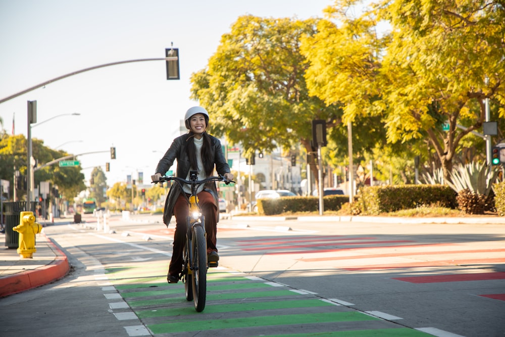 a person riding a bicycle on a street