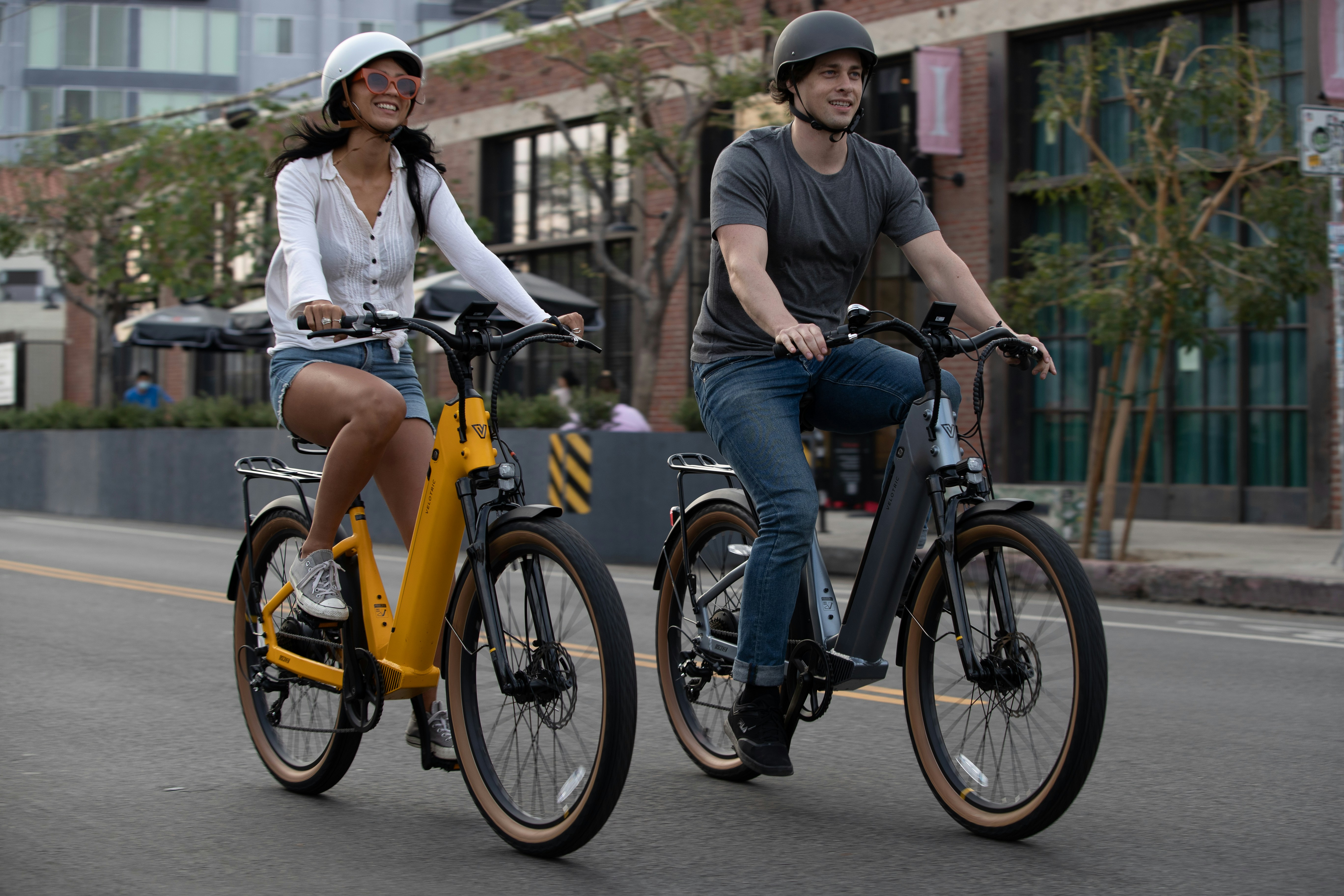 a man and woman riding bikes