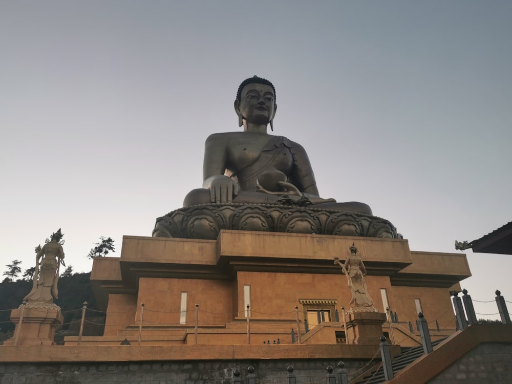 a statue of a man on a building